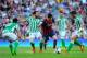 BARCELONA, SPAIN - APRIL 05: Lionel Messi of FC Barcelona duels for the ball with Jordi Figueras (2ndL) and Antonio Amaya (R) of Real Betis Balompie during the La Liga match between FC Barcelona and Real Betis Balompie at Camp Nou on April 5, 2014 in Bar