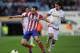 MADRID, SPAIN - MARCH 26: Juanfran (L) of Club Atletico de Madrid is tackled by Manuel Iturra of Granada CF during the La Liga match between Club Atletico de Madrid and Granada CF at Vicente Calderon Stadium on March 26, 2014 in Madrid, Spain. (Photo by