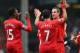 LIVERPOOL, ENGLAND - MARCH 30: Jordan Henderson of Liverpool celebrates with his team-mates Daniel Sturridge (L) and Luis Suarez after scoring the fourth goal during the Barclays Premier League match between Liverpool and Tottenham Hotspur at Anfield on