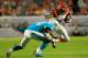 MIAMI GARDENS, FL - OCTOBER 31: Mohamed Sanu #12 of the Cincinnati Bengals is tackled by Dimitri Patterson #24 of the Miami Dolphins at Sun Life Stadium on October 31, 2013 in Miami Gardens, Florida. (Photo by Chris Trotman/Getty Images)