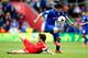 SOUTHAMPTON, ENGLAND - APRIL 12: Kim Bo-Kyung of Cardiff lifts the ball over the tackle of Jack Cork of Southampton during the Barclays Premier League match between Southampton and Cardiff City at St Mary's Stadium on April 12, 2014 in Southampton, Englan