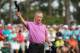 AUGUSTA, GA - APRIL 13: Miguel Angel Jimenez of Spain waves to the gallery on the 18th green during the final round of the 2014 Masters Tournament at Augusta National Golf Club on April 13, 2014 in Augusta, Georgia. (Photo by Andrew Redington/Getty Imag
