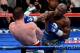 LAS VEGAS, NV - SEPTEMBER 14: (R-L) Floyd Mayweather Jr. throws a right at Canelo Alvarez during their WBC/WBA 154-pound title fight at the MGM Grand Garden Arena on September 14, 2013 in Las Vegas, Nevada. (Photo by Ethan Miller/Getty Images)
