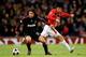 MANCHESTER, ENGLAND - MARCH 10: Andrea Pirlo of AC Milan is challenged by Ji-Sung Park (R) of Manchester United during the UEFA Champions League First Knockout Round, second leg match between Manchester United and AC Milan at Old Trafford on March 10, 20