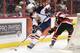 OTTAWA, ON - MARCH 13: Aaron Ekblad #5 of the Barrie Colts skates with the puck past Travis Konecny #17 of the Ottawa 67's during an OHL game at Canadian Tire Centre on March 13, 2014 in Ottawa, Ontario, Canada. (Photo by Jana Chytilova/Freestyle Photog