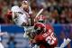 NEW ORLEANS, LA - JANUARY 02: Derrick Woods #12 of the Oklahoma Sooners makes a catch over Landon Collins #26 of the Alabama Crimson Tide during the Allstate Sugar Bowl at the Mercedes-Benz Superdome on January 2, 2014 in New Orleans, Louisiana. (Photo