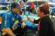 Ron Capps answers Toni Montgomery's questions in the Don Schumacher Racing hospitality area.