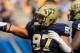 Sep 28, 2013; Pittsburgh, PA, USA; Pittsburgh Panthers defensive lineman Aaron Donald (97) celebrates a sack during the second quarter against the Virginia Cavaliers at Heinz Field. Mandatory Credit: Howard Smith-USA TODAY Sports