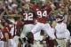 Darrington Sentimore (94) celebrates near the end of 2010 BCS title-game win over Texas.