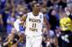 ST LOUIS, MO - MARCH 23: Cleanthony Early #11 of the Wichita State Shockers celebrates after a basket in the second half against the Kentucky Wildcats during the third round of the 2014 NCAA Men's Basketball Tournament at Scottrade Center on March 23, 20