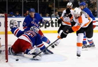 NEW YORK, NY - APRIL 20: Jakub Voracek #93 of the Philadelphia Flyers shoots the puck past goalie Henrik Lundqvist #30 of the New York Rangers for a goal during the first period in Game Two of the First Round of the 2014 NHL Stanley Cup Playoffs at Madis