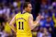INDIANAPOLIS, IN - MARCH 30: Nik Stauskas #11 of the Michigan Wolverines celebrates a three pointer in the first half against the Kentucky Wildcats during the midwest regional final of the 2014 NCAA Men's Basketball Tournament at Lucas Oil Stadium on Mar