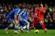 LONDON, ENGLAND - DECEMBER 29: Philippe Coutinho of Liverpool is challenged by Branislav Ivanovic (L) and Oscar (C) of Chelsea during the Barclays Premier League match between Chelsea and Liverpool at Stamford Bridge on December 29, 2013 in London, Engla