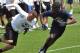 Ali, right, is a coveted cornerback prospect.