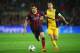 BARCELONA, SPAIN - APRIL 01: Cesc Fabregas of Barcelona goes past Gabi of Club Atletico de Madrid during the UEFA Champions League Quarter Final first leg match between FC Barcelona and Club Atletico de Madrid at Camp Nou on April 1, 2014 in Barcelona, S