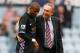 LONDON, ENGLAND - APRIL 16: Ashley Young of Aston Villa and Aston Villa manager Gerard Houllier celebrate victory in the Barclays Premier League match between West Ham United and Aston Villa at the Boleyn Ground on April 16, 2011 in London, England. (Ph