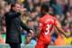 NORWICH, ENGLAND - APRIL 20: Raheem Sterling of Liverpool celebrates scoring the opening goal with Manager Brendan Rodgers of Liverpool during the Barclays Premier League match between Norwich City and Liverpool at Carrow Road on April 20, 2014 in Norwic