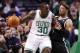 Jan 26, 2014; Boston, MA, USA; Brooklyn Nets small forward Paul Pierce (right) defends Boston Celtics power forward Brandon Bass (30) during the first half at TD Garden. Mandatory Credit: Mark L. Baer-USA TODAY Sports