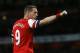 Podolski celebrates one of his two goals against West Ham United in Arsenal's recent victory.