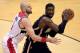 WASHINGTON, DC - MARCH 28: Roy Hibbert #55 of the Indiana Pacers tries to pass the ball around Marcin Gortat #4 of the Washington Wizards during the second half of the Wizards 91-78 win at Verizon Center on March 28, 2014 in Washington, DC. NOTE TO USER:
