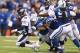 INDIANAPOLIS, IN - OCTOBER 20: Peyton Manning #18 of the Denver Broncos is sacked during the game against the Indianapolis Colts at Lucas Oil Stadium on October 20, 2013 in Indianapolis, Indiana. (Photo by Andy Lyons/Getty Images)