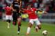 EINDHOVEN, NETHERLANDS - AUGUST 17: Memphis Depay (R) of PSV and Mawouna Kodjo Amevor of Go Ahead Eagles battle for the ball during the Eredivisie match between PSV Eindhoven and Go Ahead Eagles at Philips Stadion on August 17, 2013 in Eindhoven, Netherl