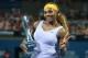 BRISBANE, AUSTRALIA - JANUARY 04: Serena Williams of the USA poses with the winners trophy after winning her finals match against Victoria Azarenka of Belarus during day seven of the 2014 Brisbane International at Queensland Tennis Centre on January 4, 2