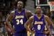 MINNEAPOLIS - MAY 29: Shaquille O'Neal #34 and Kobe Bryant #8 of the Los Angeles Lakers stand on the court while playing againt the Minnesota Timberwolves in Game Five of the Western Conference Finals during the 2004 NBA Playoffs on May 29, 2004 at Targe