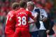 LIVERPOOL, ENGLAND - APRIL 27: (EDITORS NOTE: Retransmission of image 487057275 with alternate crop.) Steven Gerrard and Jon Flanagan of Liverpool have words with Jose Mourinho manager of Chelsea as he holds onto the ball during the Barclays Premier Leagu