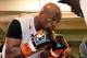 LAS VEGAS, NV - APRIL 22: Boxer Floyd Mayweather Jr. works out with his trainer and uncle Roger Mayweather at the Mayweather Boxing Club on April 22, 2014 in Las Vegas, Nevada. Mayweather will face Marcos Maidana in a 12-round world championship unificat