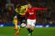 MANCHESTER, ENGLAND - JANUARY 22: Marcos Alonso of Sunderland and Adnan Januzaj of Manchester United battle for possession during the Capital One Cup semi final, second leg match between Manchester United and Sunderland at Old Trafford on January 22, 201