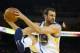Mar 14, 2014; Oakland, CA, USA; Golden State Warriors center Andrew Bogut (12) controls a rebound against the Cleveland Cavaliers during the second quarter at Oracle Arena. Mandatory Credit: Kelley L Cox-USA TODAY Sports