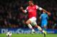 LONDON, ENGLAND - NOVEMBER 26: Theo Walcott of Arsenal breaks with the ball during the UEFA Champions League Group F match between Arsenal and Olympique de Marseille at Emirates Stadium on November 26, 2013 in London, England. (Photo by Shaun Botterill/