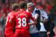 LIVERPOOL, ENGLAND - APRIL 27: (EDITORS NOTE: Retransmission of image 487057275 with alternate crop.) Steven Gerrard and Jon Flanagan of Liverpool have words with Jose Mourinho manager of Chelsea as he holds onto the ball during the Barclays Premier Leagu