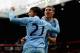 MANCHESTER, ENGLAND - OCTOBER 23: David Silva and James Milner of Manchester City celebrate during the Barclays Premier League match between Manchester United and Manchester City at Old Trafford on October 23, 2011 in Manchester, England. (Photo by Lauren