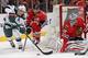 CHICAGO, IL - MAY 02: Nick Parise #11 of the Minnesota Wild tries to get off a shot at Corey Crawford #50 of the Chicago Blackhawks as Jonathan Toews #19 applies pressure in Game One of the Second Round of the 2014 NHL Stanley Cup Playoffs at the United C