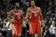 Nov 30, 2013; San Antonio, TX, USA; Houston Rockets guard James Harden (13) and forward Dwight Howard (12) react against the San Antonio Spurs during the second half at the AT&T Center. Houston beat San Antonio 112-106. Mandatory Credit: Brendan Maloney-U