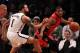 Apr 27, 2014; Brooklyn, NY, USA; Toronto Raptors guard Kyle Lowry (7) against Brooklyn Nets guard Deron Williams (8) during the second half in game four of the first round of the 2014 NBA Playoffs at Barclays Center. The Raptors defeated the Nets 87-79. M