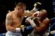 LAS VEGAS, NV - MAY 03: (L-R) Marcos Maidana and Floyd Mayweather Jr. exchange blows during their WBC/WBA welterweight unification fight at the MGM Grand Garden Arena on May 3, 2014 in Las Vegas, Nevada. (Photo by Harry How/Getty Images)