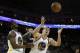 April 15, 2013; Oakland, CA, USA; Golden State Warriors power forward David Lee (10) looks to control the rebound with small forward Harrison Barnes (40) ahead of San Antonio Spurs center DeJuan Blair (45) during the third quarter at Oracle Arena. The Gol