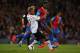 LONDON, ENGLAND - MAY 05: Glen Johnson of Liverpool and Yannick Bolasie of Crystal Palace compete for the ball during the Barclays Premier League match between Crystal Palace and Liverpool at Selhurst Park on May 5, 2014 in London, England. (Photo by Cl