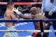 LAS VEGAS, NV - MAY 03: (R-L) Floyd Mayweather Jr. throws a left to the face of Marcos Maidana during their WBC/WBA welterweight unification fight at the MGM Grand Garden Arena on May 3, 2014 in Las Vegas, Nevada. (Photo by Ethan Miller/Getty Images)