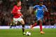 MANCHESTER, ENGLAND - MAY 06: Adnan Januzaj of Manchester United competes with Maynor Figueroa of Hull City during the Barclays Premier League match between Manchester United and Hull City at Old Trafford on May 6, 2014 in Manchester, England. (Photo by