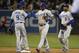 SAN DIEGO, CA - APRIL 2: Los Angeles Dodgers players high-five after beating the San Diego Padres 5-1 in a baseball game at Petco Park April 2, 2014 in San Diego, California. (Photo by Denis Poroy/Getty Images)