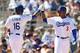 GLENDALE, AZ - MARCH 10: Carl Crawford #3 of the Los Angeles Dodgers high fives Andre Ethier #16 after Ethier hit a three run home-run against the Oakland Athletics during the first inning of the spring training game at Camelback Ranch on March 10, 2014