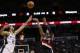 May 6, 2014; San Antonio, TX, USA; Portland Trail Blazers guard Damian Lillard (0) shoots the ball over San Antonio Spurs forward Tim Duncan (21) in game one of the second round of the 2014 NBA Playoffs at AT&T Center. Mandatory Credit: Soobum Im-USA TODA