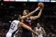 May 6, 2014; San Antonio, TX, USA; Portland Trail Blazers center Robin Lopez (42) shoots the ball against San Antonio Spurs forward Tim Duncan (21) in game one of the second round of the 2014 NBA Playoffs at AT&T Center. Mandatory Credit: Soobum Im-USA TO