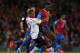 LONDON, ENGLAND - MAY 05: Glen Johnson of Liverpool and Yannick Bolasie of Crystal Palace compete for the ball during the Barclays Premier League match between Crystal Palace and Liverpool at Selhurst Park on May 5, 2014 in London, England. (Photo by Cl