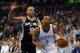 Apr 3, 2014; Oklahoma City, OK, USA; Oklahoma City Thunder guard Russell Westbrook (0) drives to the basket against San Antonio Spurs guard Tony Parker (9) during the first quarter at Chesapeake Energy Arena. Mandatory Credit: Mark D. Smith-USA TODAY Spor