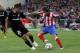 MADRID, SPAIN - APRIL 19: Diego Ribas of Atletico Madrid duels for the ball with Ricardo Costa of Valencia during the UEFA Europa League Semi Final first leg match between Atletico Madrid and Valencia at Vicente Calderon stadium on April 19, 2012 in Madri